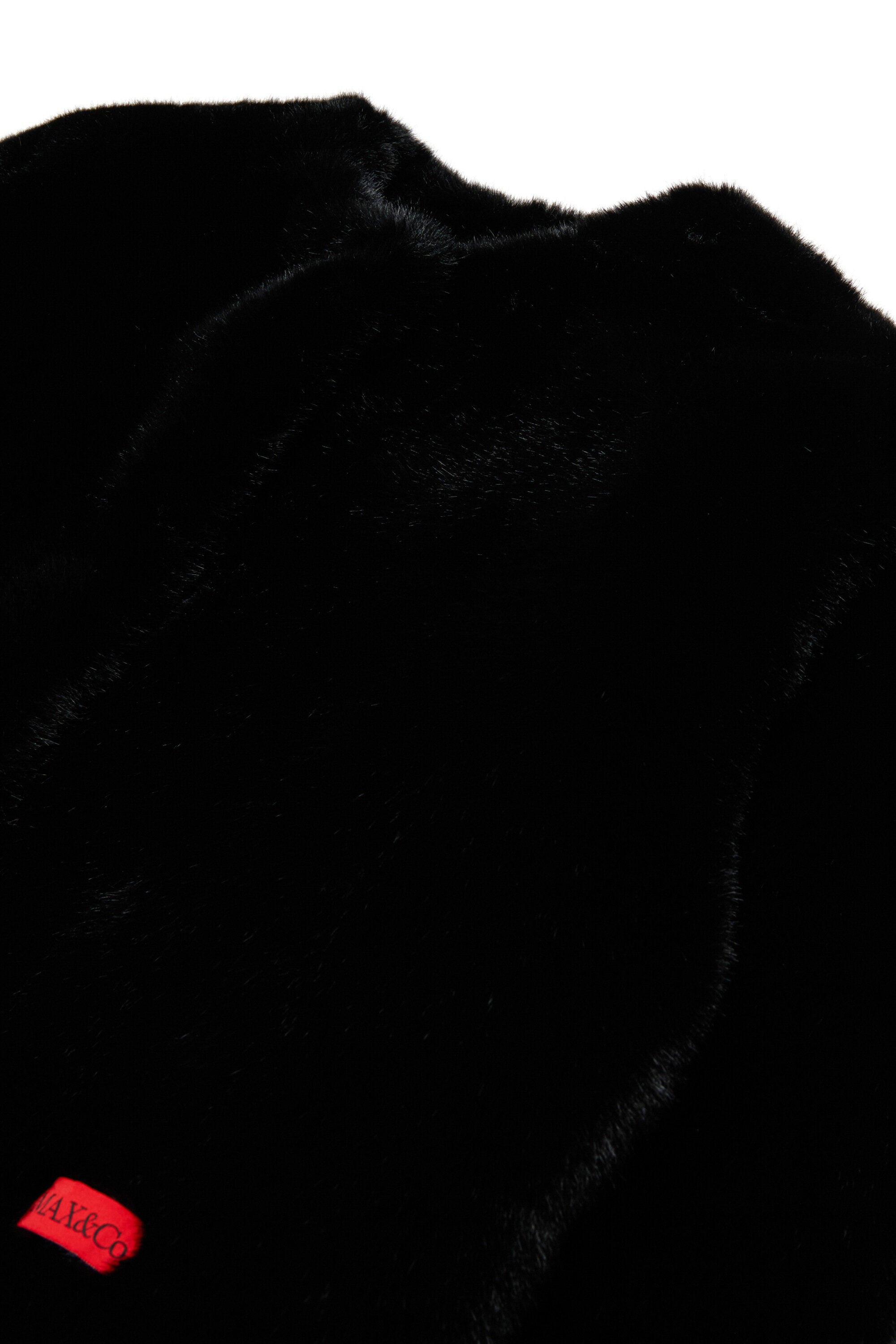 Veste en fausse fourrure avec logo