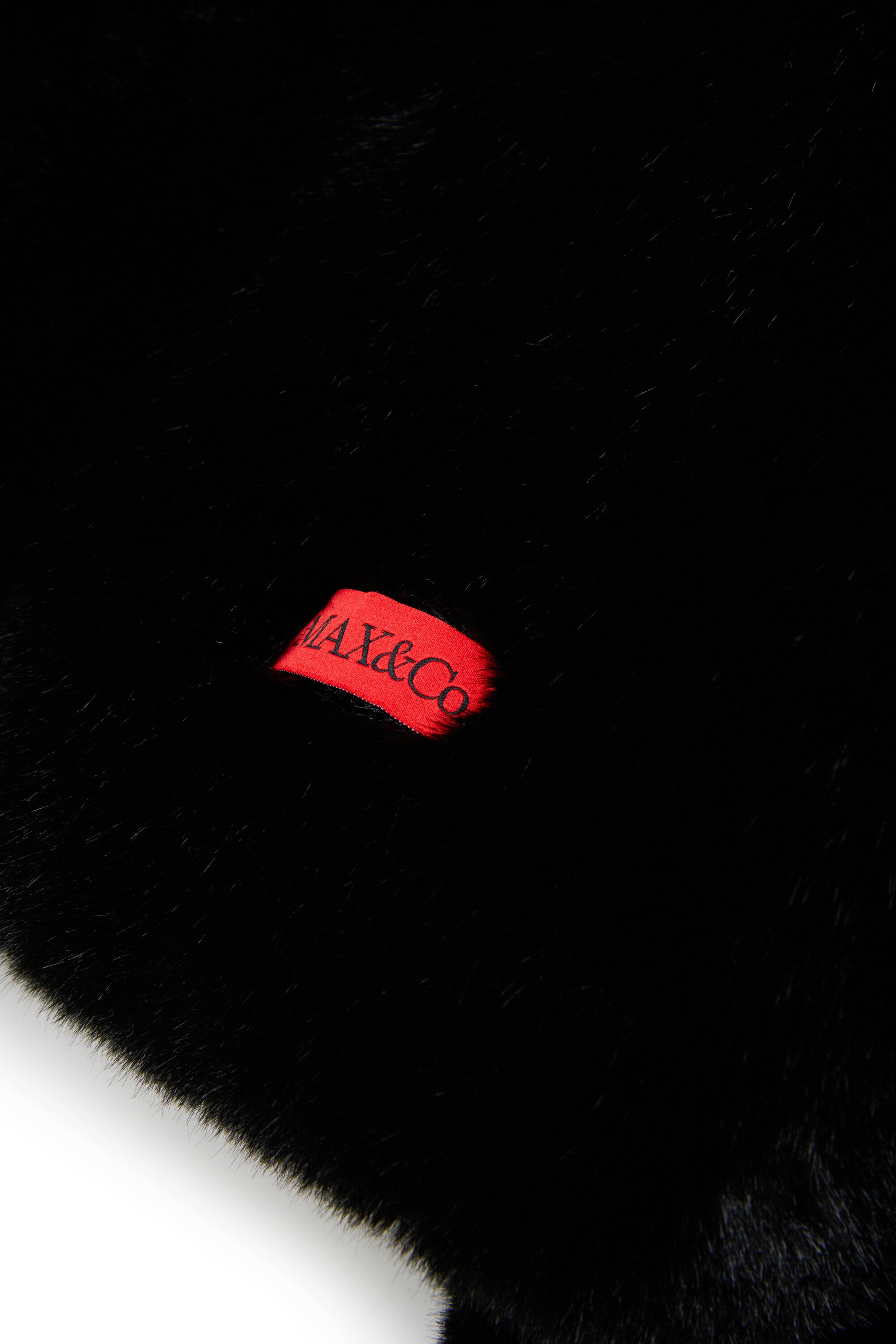 Veste en fausse fourrure avec logo