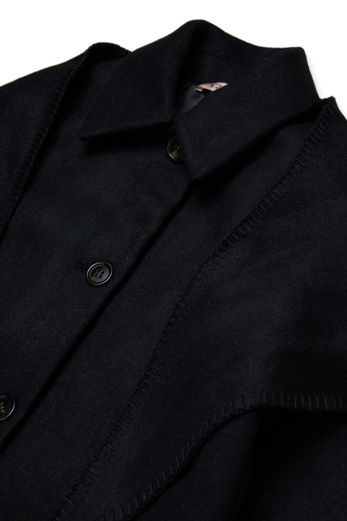 Manteau avec cape décorative